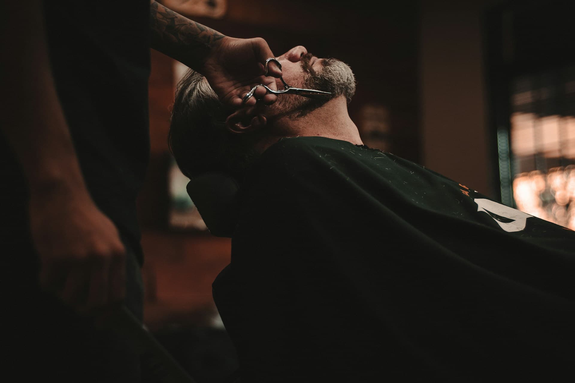 Barber giving a precision haircut