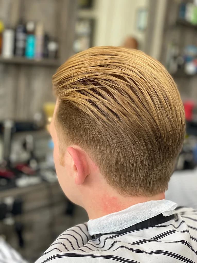 Classic slicked-back hairstyle with a clean neck taper